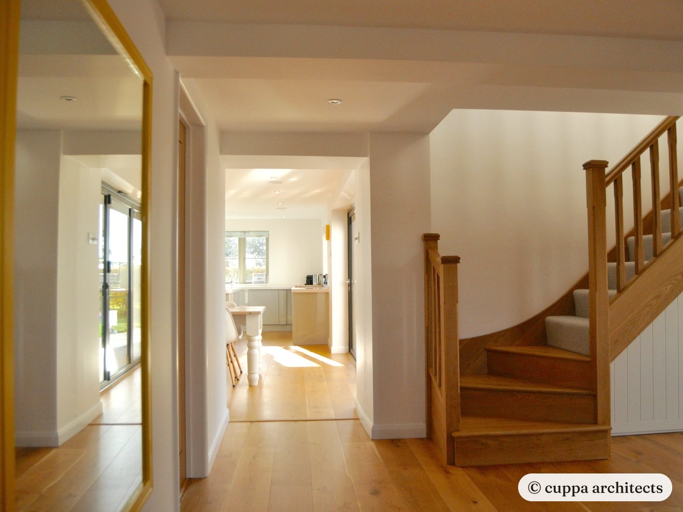 A new oak stair and hallway looking through to the kitchen