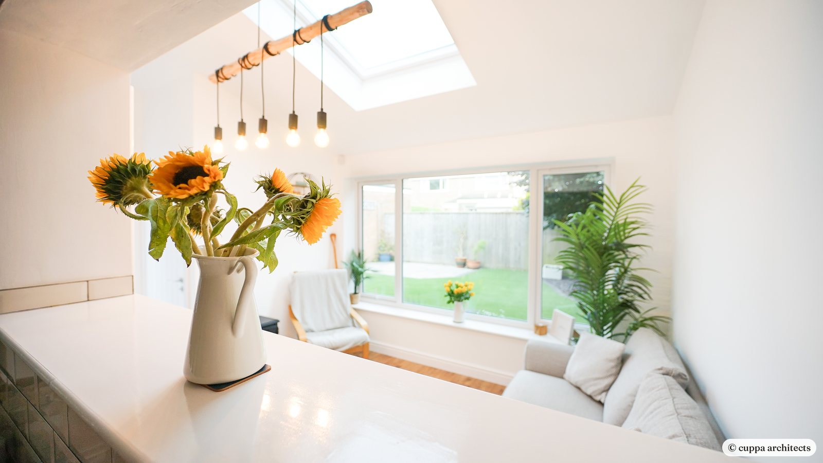A bright garden room extension with a window seat and rooflights