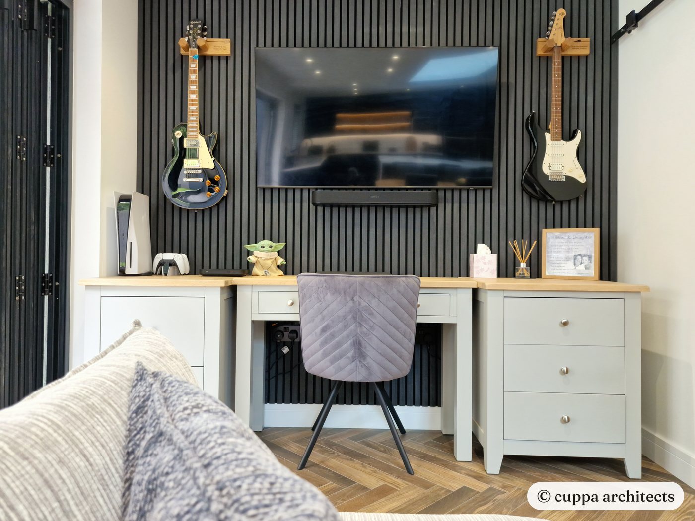 Inside the extension, a desk against dark timber panelling