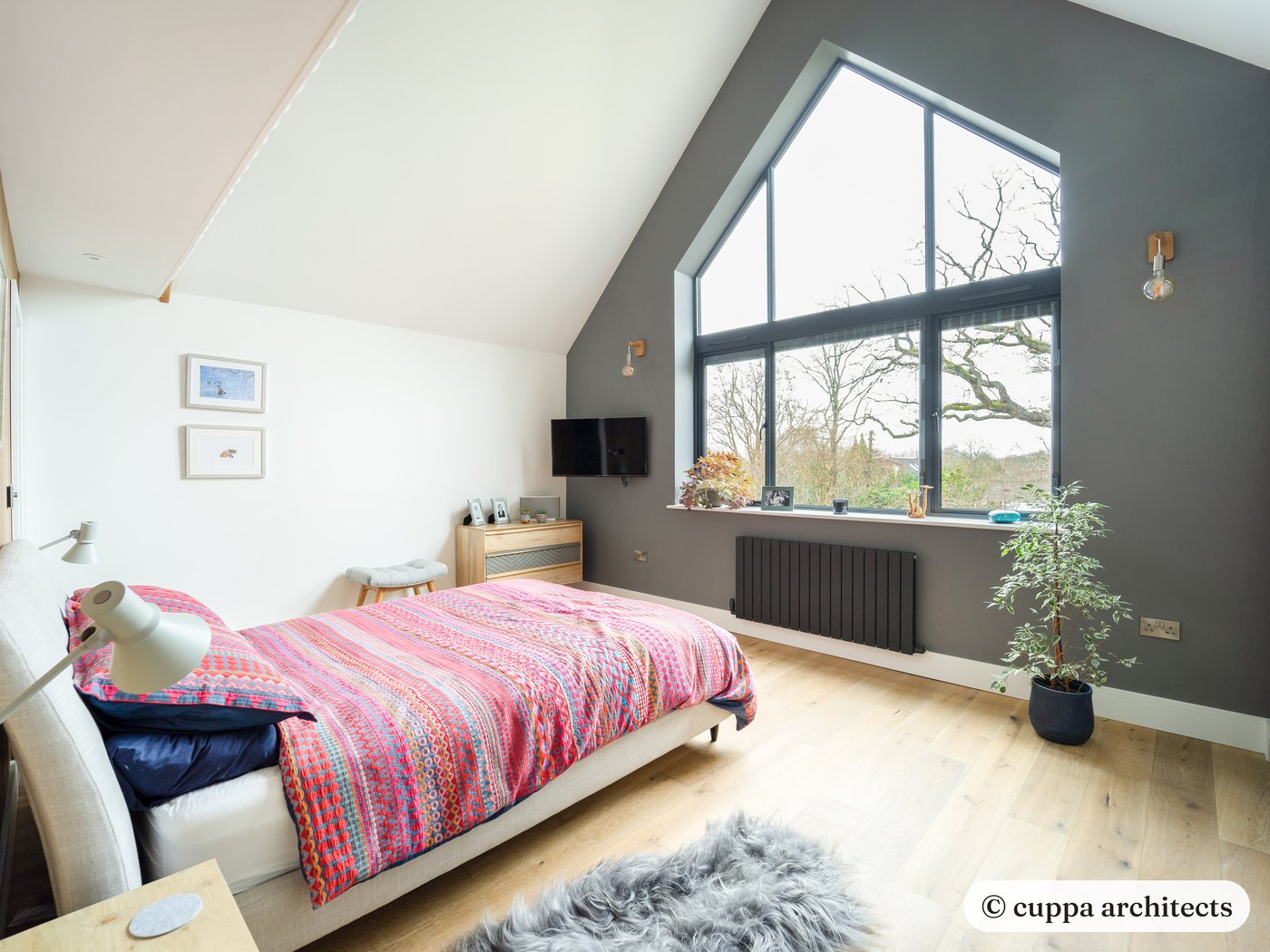 A vaulted bedroom under the new glazed gable